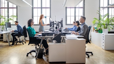 colleagues-sitting-at-desk